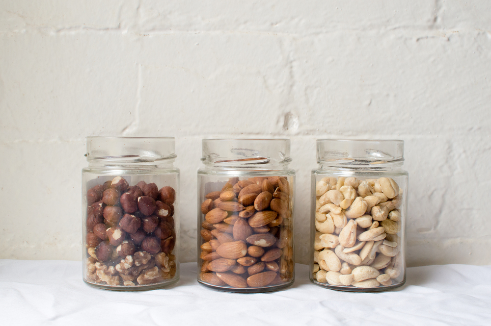 https://www.candyclub.com/blog/wp-content/uploads/2017/07/hazelnuts-almonds-cashews-open-glass-jars.jpg
